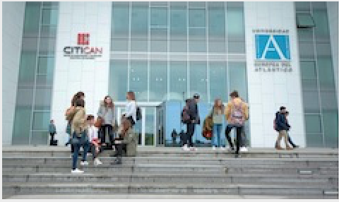 Students on the steps of a building of University Europea del Atlantico campus.